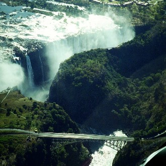 This photo of Zimbabwe's Victoria Falls was taken by Neil Gould of Sydney, Australia.  The bridge, which opened in 1905 is actually the link between the two African countries of Zimbabwe and Zambia.  Victoria Falls is considered one of the Seven Natural Wonders of the World.